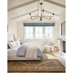 Philomena chandelier light fixture with sweeping arms and candle-shaped lights.