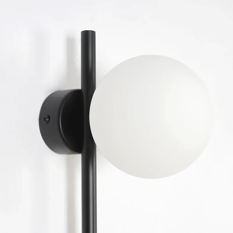 white globe wall fixture