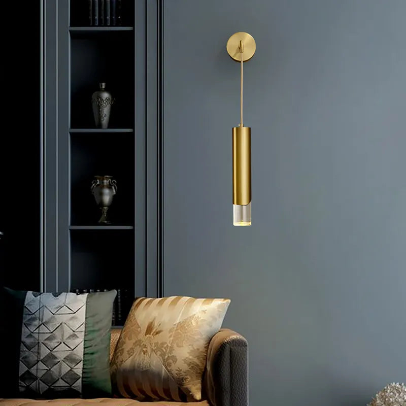 armed brass cylinder sconce